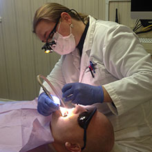 Dr. Mattson working working on dental patient