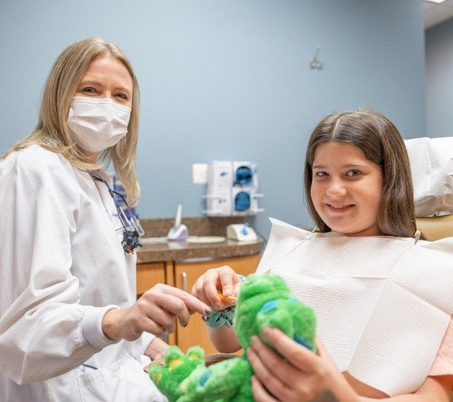 Child and dentist smiling childrens dentistry Owings Mills