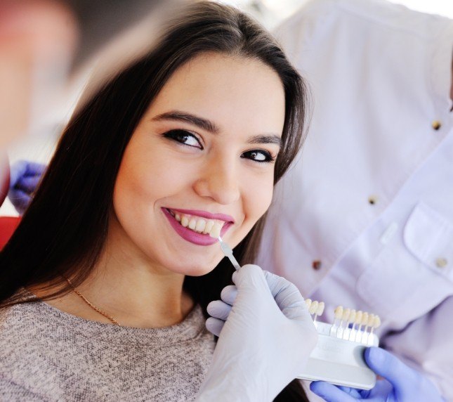 Woman receiving veneers from cosmetic dentist in Owings Mills