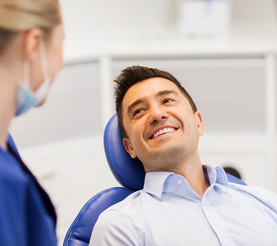 Man smiling at the dentist