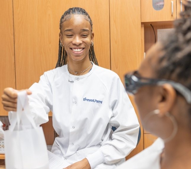 Dentist talking to a dental patient