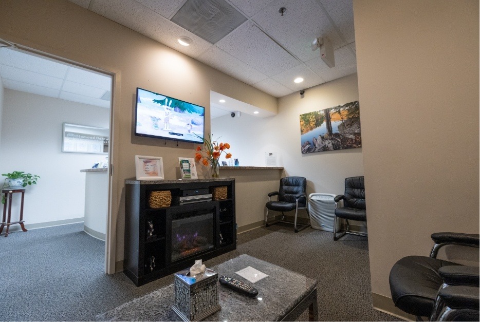 Dental office waiting room with a television screen