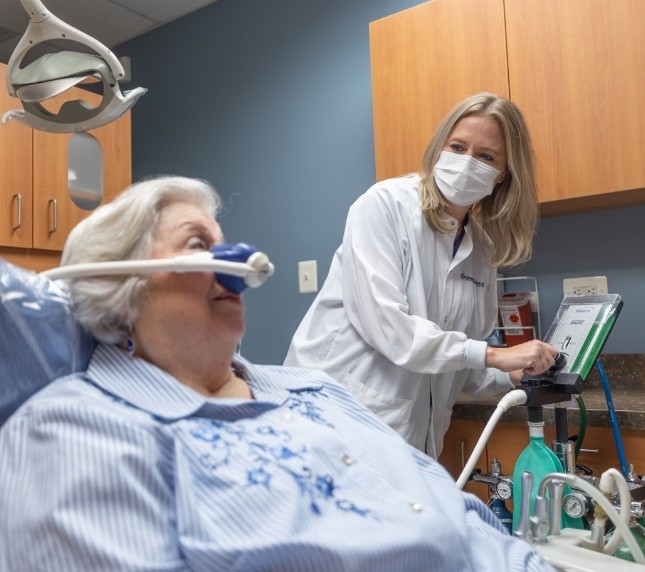 Female dental patient receiving nitrous oxide sedation