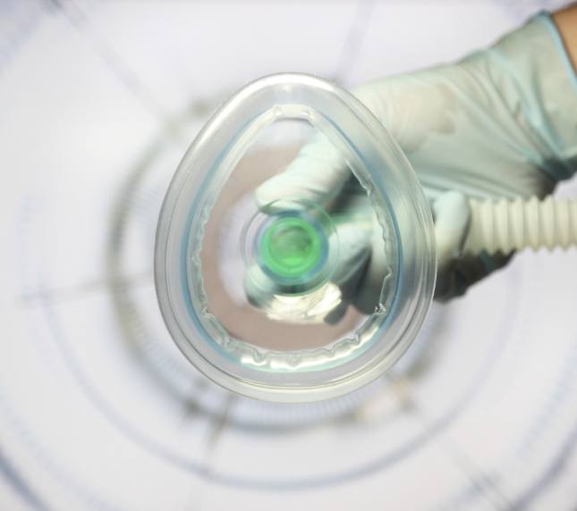 POV shot of nitrous oxide mask being placed on patient